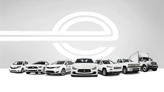 The Enterprise e logo above a lineup of rental cars, SUVs and trucks